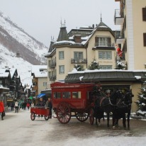 Traditional passenger pickup and delivery by horsedrawn carriage at the Mont Cervin Palace Hotel.