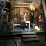 Teenagers explore the Little Tramp's cabin in The Gold Rush.